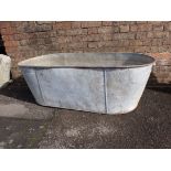 A GALVANISED TIN BATH, WITH CARRYING HANDLES