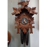 A CUCKOO CLOCK, OF TRADITIONAL FORM