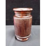 A LIGNUM VITAE TURNED VASE