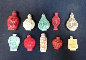 A COLLECTION OF CHINESE CARVED RESIN SNUFF BOTTLES