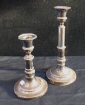 A PAIR OF GEORGE III SILVER EXTENDING CANDLESTICKS
