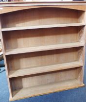 A LIMED OAK PLATE RACK/BOOKCASE