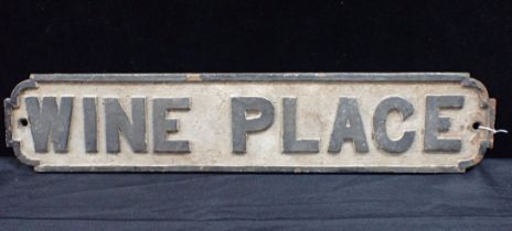 A CAST IRON STREET SIGN; 'WINE PLACE'