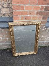 A GILT 'CARTON PIERRE' TYPE FRAMED MIRROR