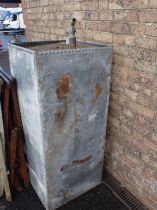 A LARGE GALVANISED WATER TANK, WITH BRASS TAP