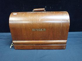 A CASED SINGER SEWING MACHINE