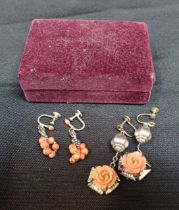 A PAIR OF CARVED ROSE CORAL AND WHITE METAL SCREW BACK EARRINGS