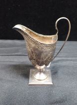 A GEORGE III SILVER MILK JUG, LONDON 1795