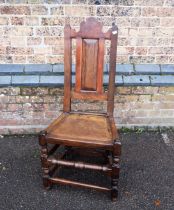 AN OAK AND MAHOGANY COUNTRY CHAIR OF 17TH CENTURY DESIGN