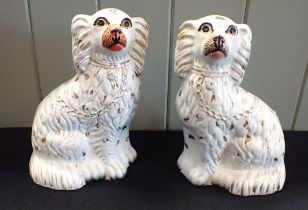 A PAIR OF STAFFORDSHIRE SPANIELS