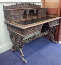 A 19TH CENTURY ANGLO-INDIAN CARVED HARDWOOD DESK