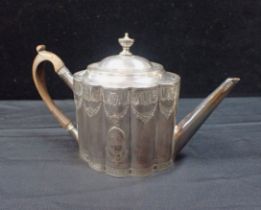 A GEORGE III SILVER TEAPOT