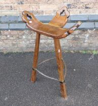 A HIGH STOOL, IN THE FORM OF A BIRTHING CHAIR
