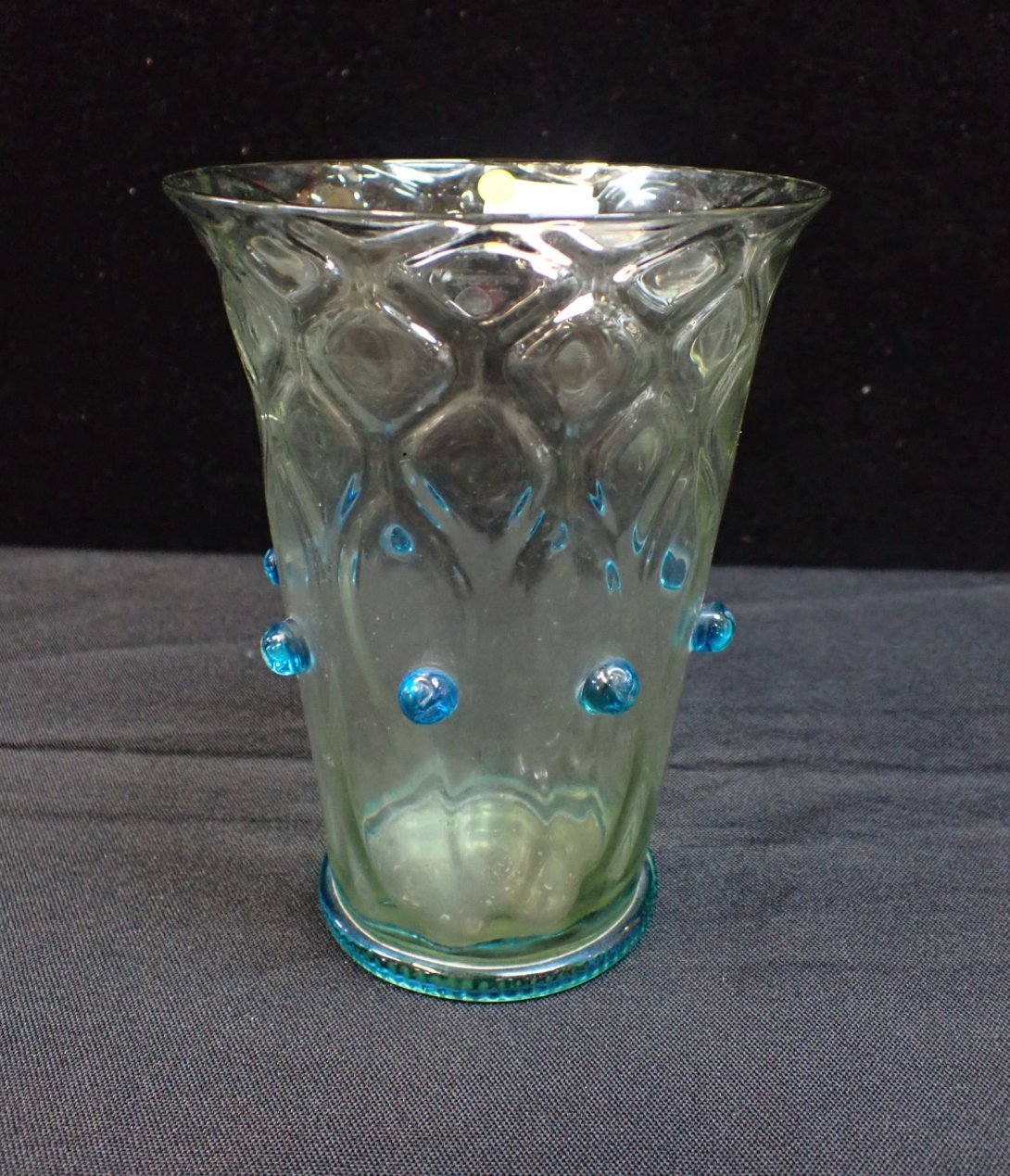 A FLARED GLASS BEAKER OR VASE WITH LATTICE DESIGN