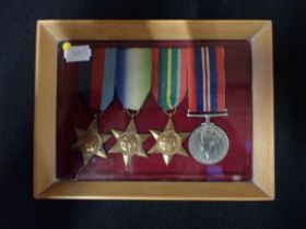 A WWII MEDAL GROUP, FRAMED WITH RIBBONS