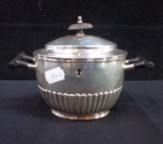 A SILVER TEA CADDY