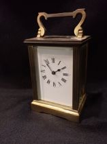 A BRASS CARRIAGE CLOCK