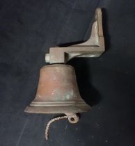 A SHIP'S BELL, ON BRACKET