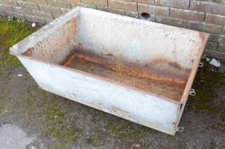 A GALVANISED METAL TROUGH