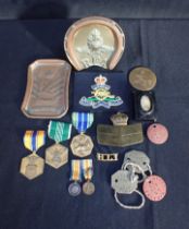 A COLLECTION OF TRENCH ART AND BADGES