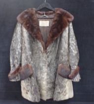 A SEAL SKIN AND RANCH MINK FUR COAT FROM THE 1940'S