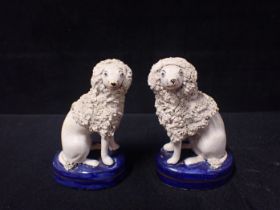 A PAIR OF STAFFORDSHIRE STYLE POODLES