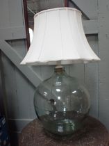 A LARGE GLASS CARBOY BOTTLE LAMP