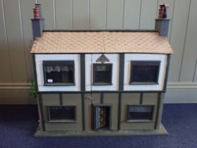 A RESTORED AND FURNISHED DOLLS HOUSE