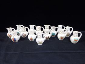 A COLLECTION OF CRESTED WARE MINIATURE PUZZLE JUGS