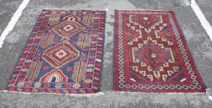 TWO BELOUCHI RUGS EACH WITH LOZENGE MEDALLIONS