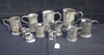 A COLLECTION OF ANTIQUE PEWTER PUB MEASURES
