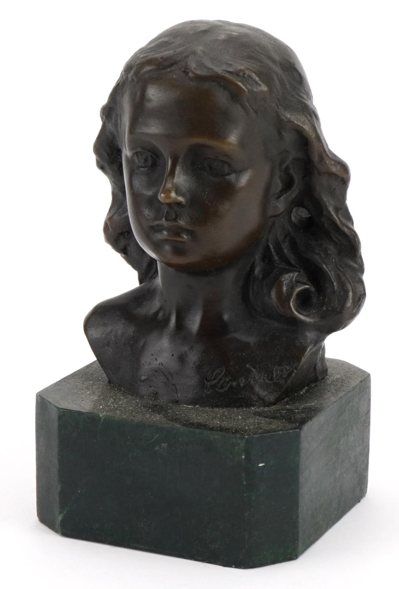 Patinated bronze bust of a female raised on a green marbleised base, 15cm high