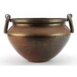Large antique bronzed copper bowl with ring handles, 40cm wide