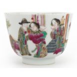 Chinese porcelain bowl hand painted in the famille rose palette with figures in a palace setting,