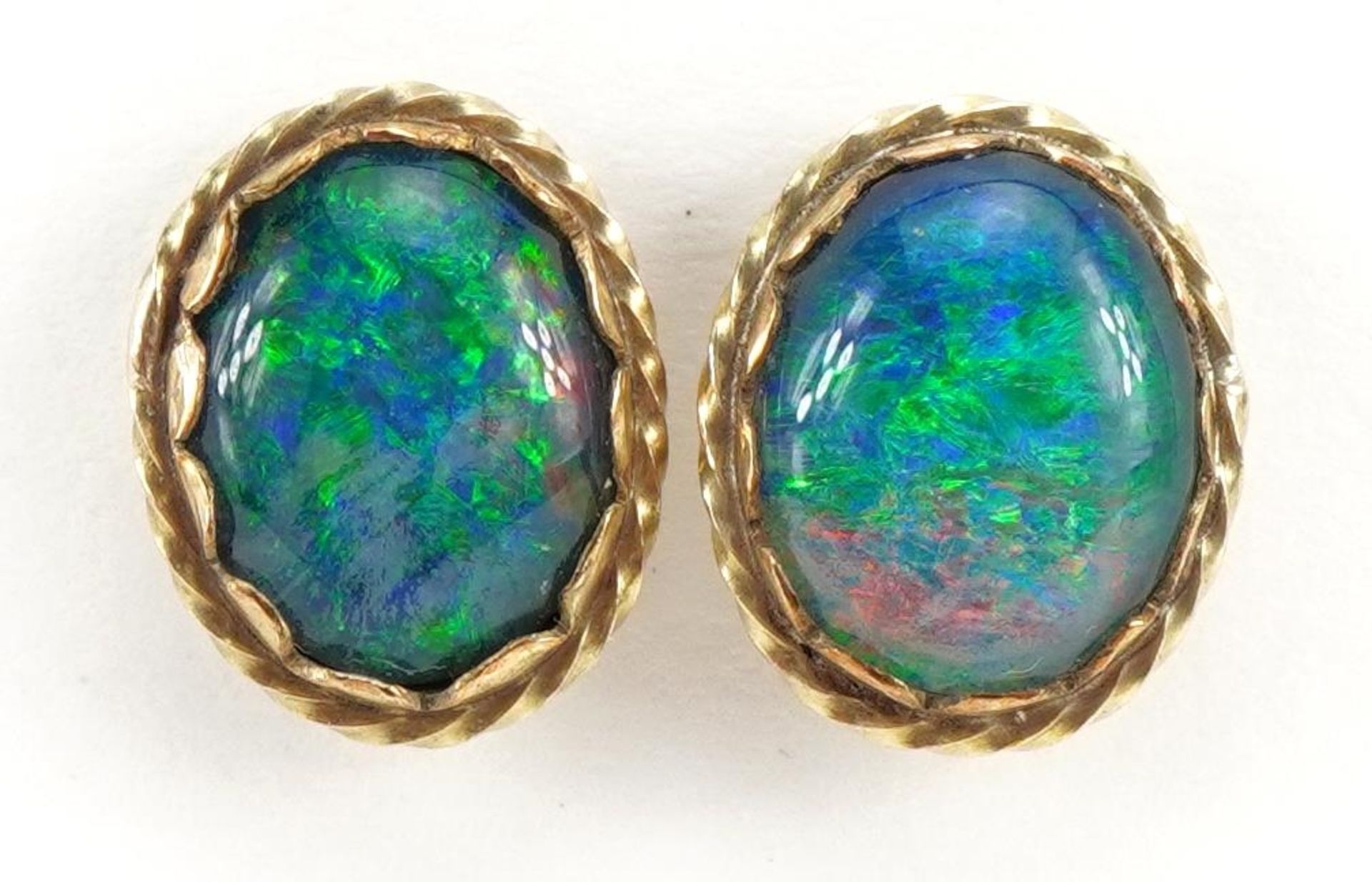 Pair of unmarked gold cabochon opal stud earrings, 1.2cm high, 2.2g