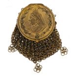 Victorian brass miser's purse with a bust of Queen Victorian and sovereign holder, 9cm high