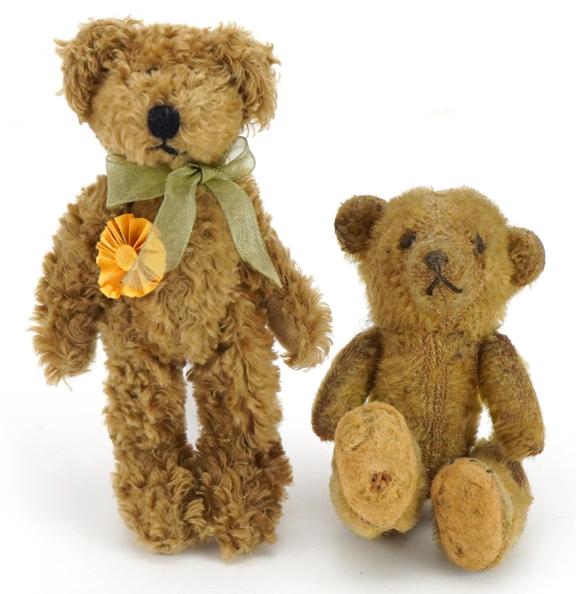 Vintage miniature straw filled teddy bear and one other, the largest 14cm high