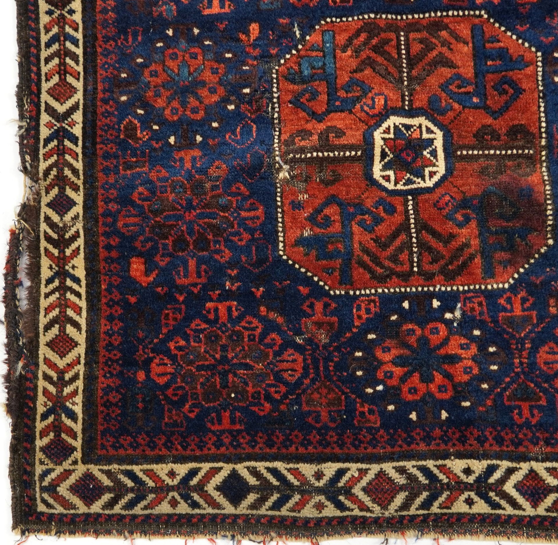 Afghan red and blue ground Belutch rug with all over geometric design, 86cm x 76cm - Image 2 of 3