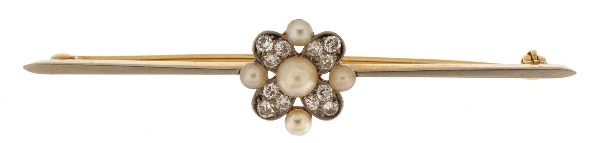 Unmarked gold and white metal diamond and pearl flower head bar brooch, 6.4cm wide, 6.1g