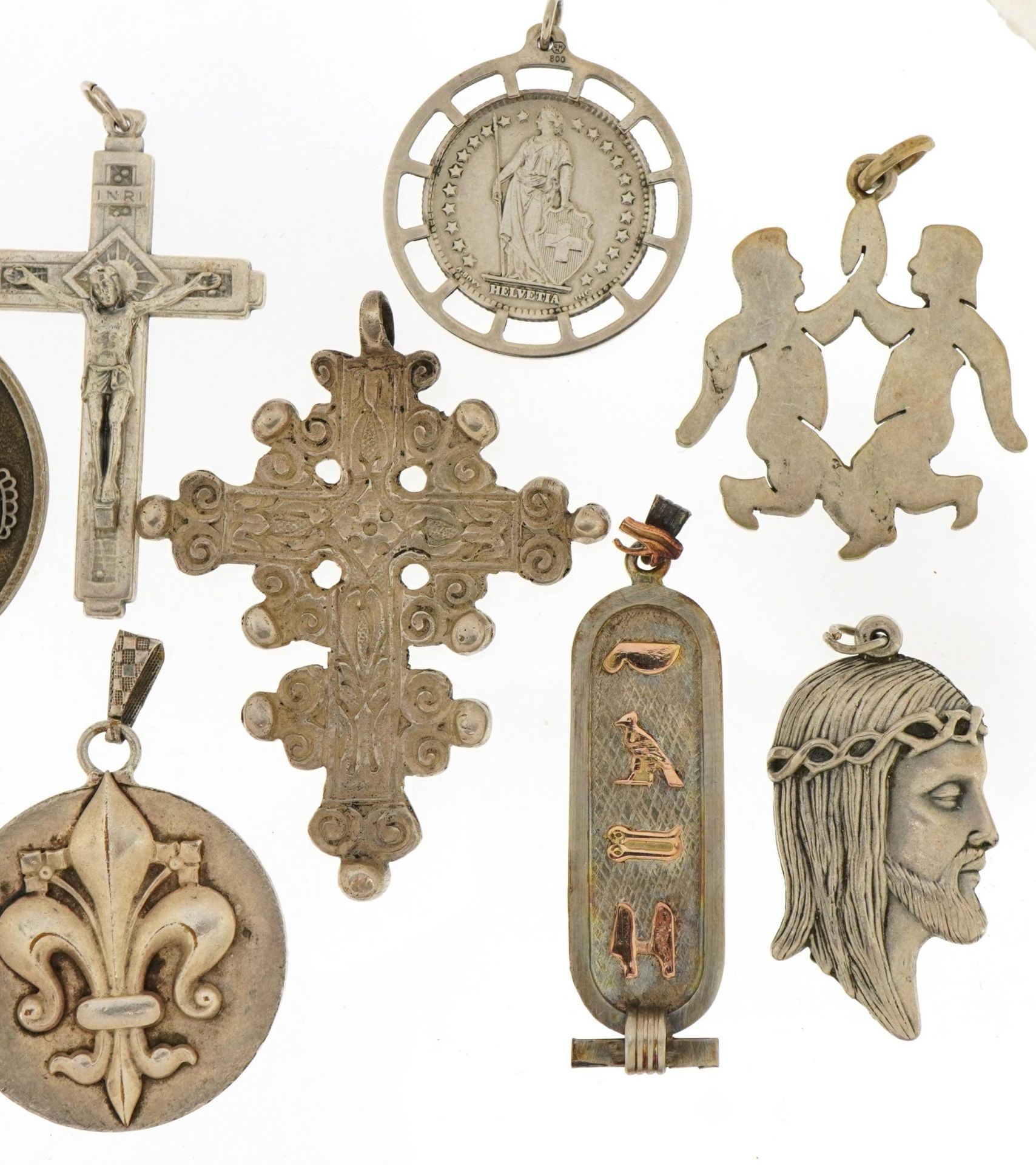Silver and white metal pendants including Rococo style cross, Nefertiti and fleur de lis Joan of - Image 3 of 5