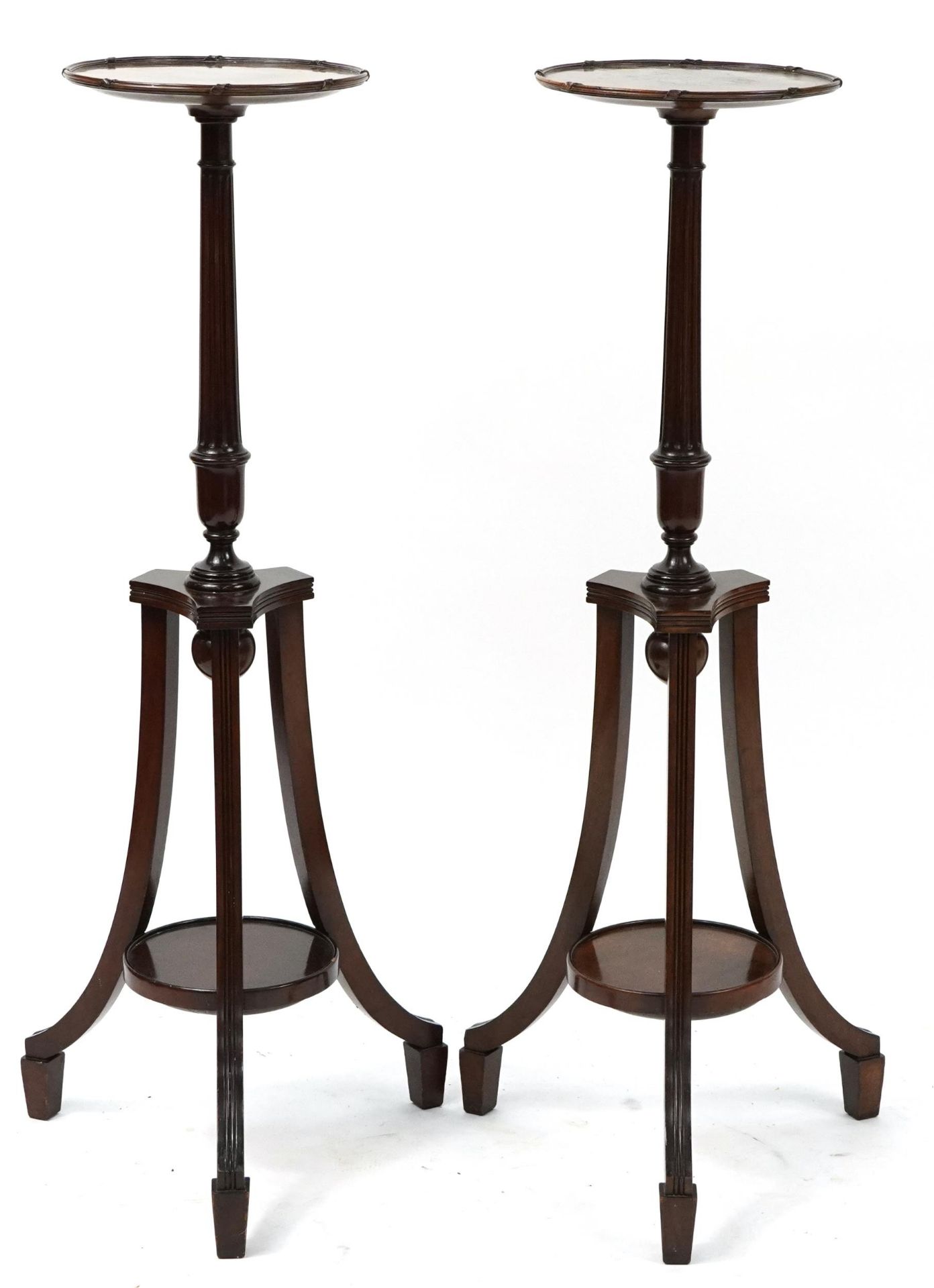 Pair of mahogany tripod jardiniere stands with under tiers, each 106cm high