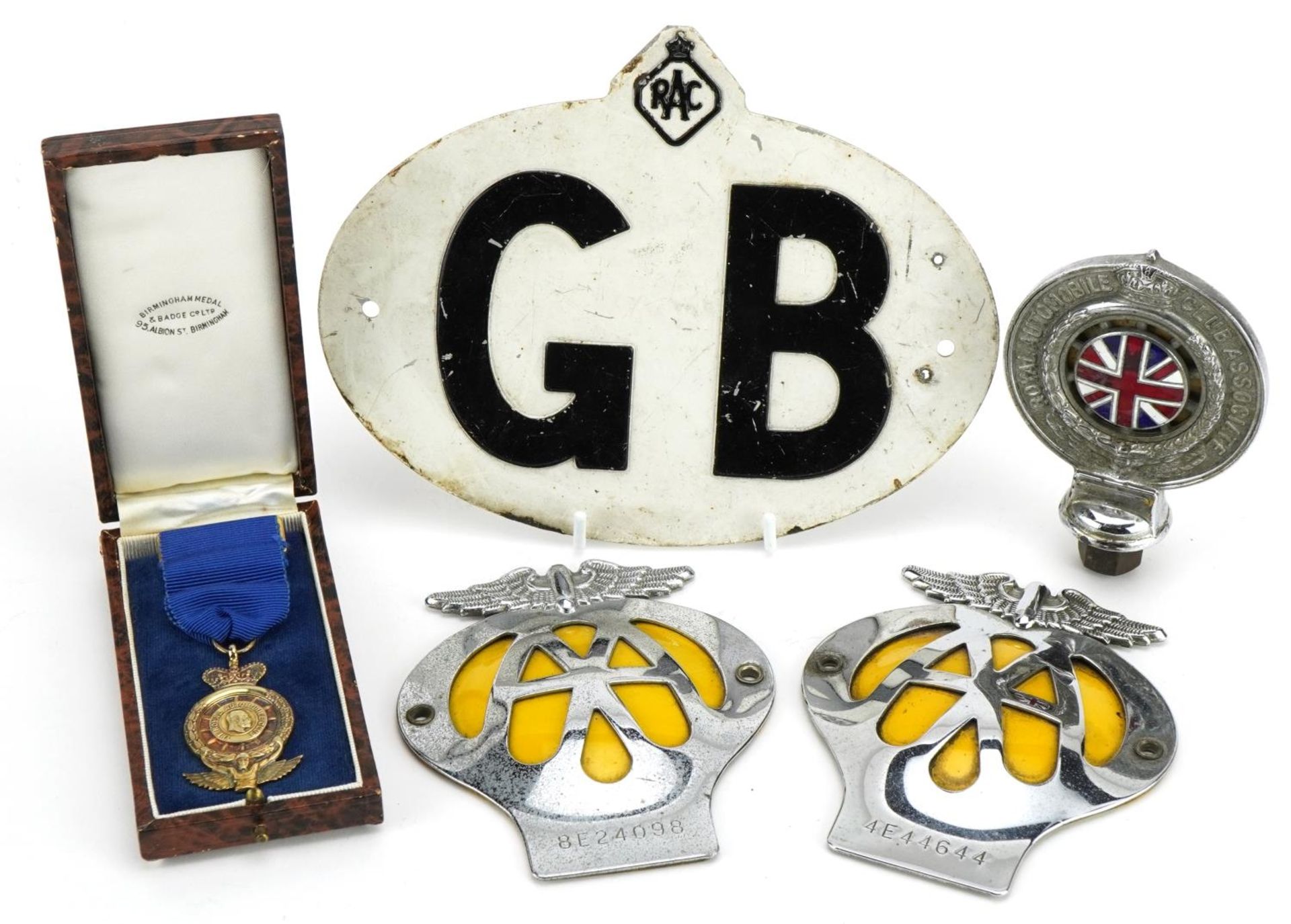 Auto memorabilia comprising a silver gilt The Royal Automobile Club jewel with ribbon and box, two