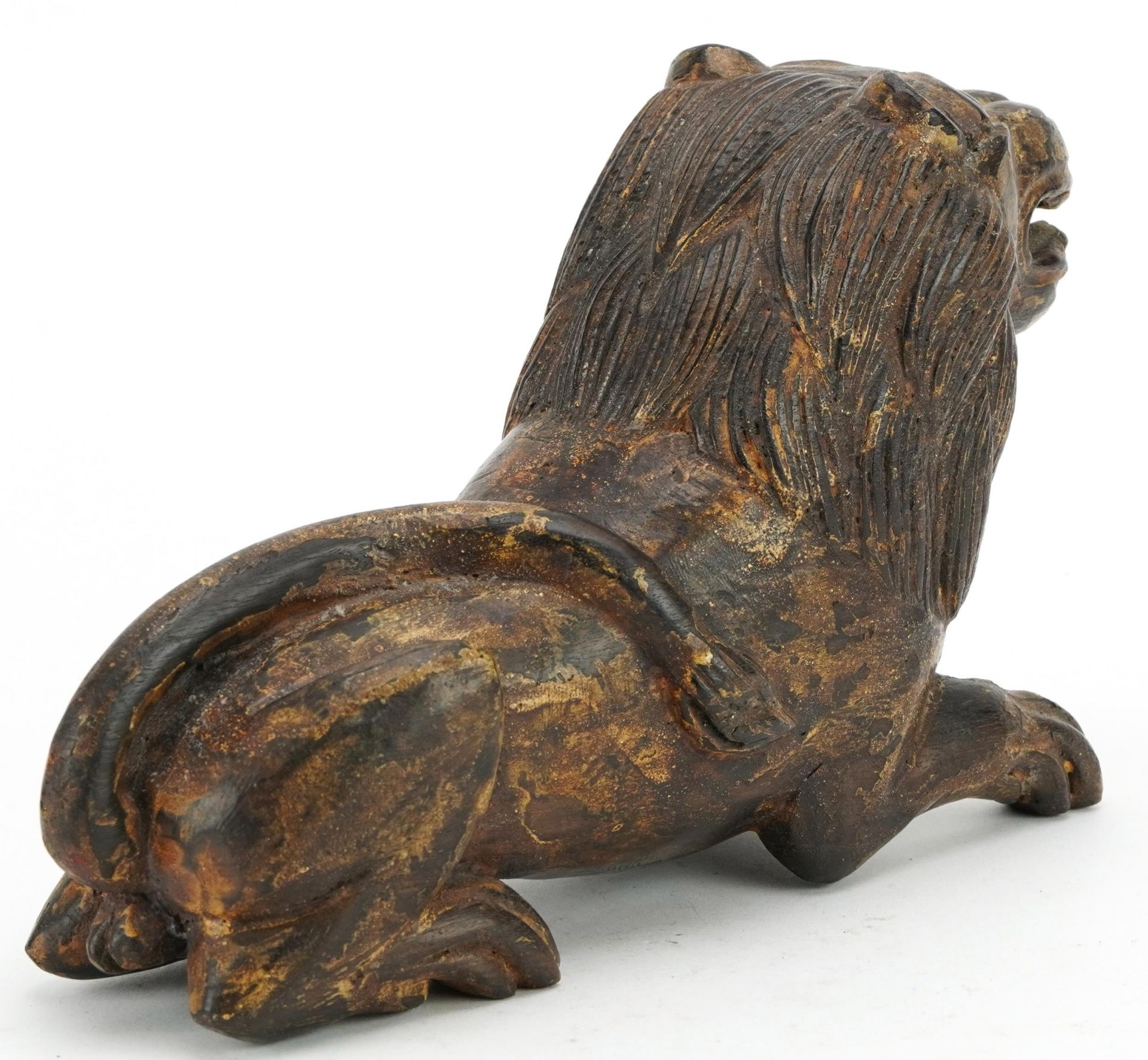 Chinese carved hardwood lion with remnants of paint, 26cm in length - Image 2 of 3