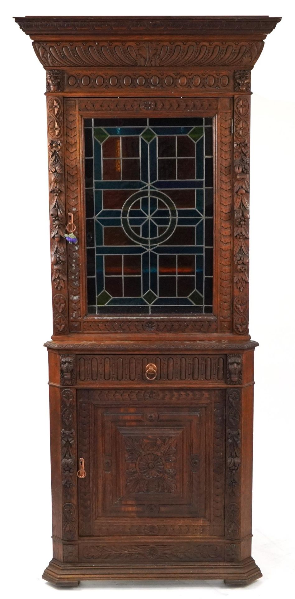 Carved oak corner cupboard with stained glass panel door above a drawer and cupboard door, 220cm