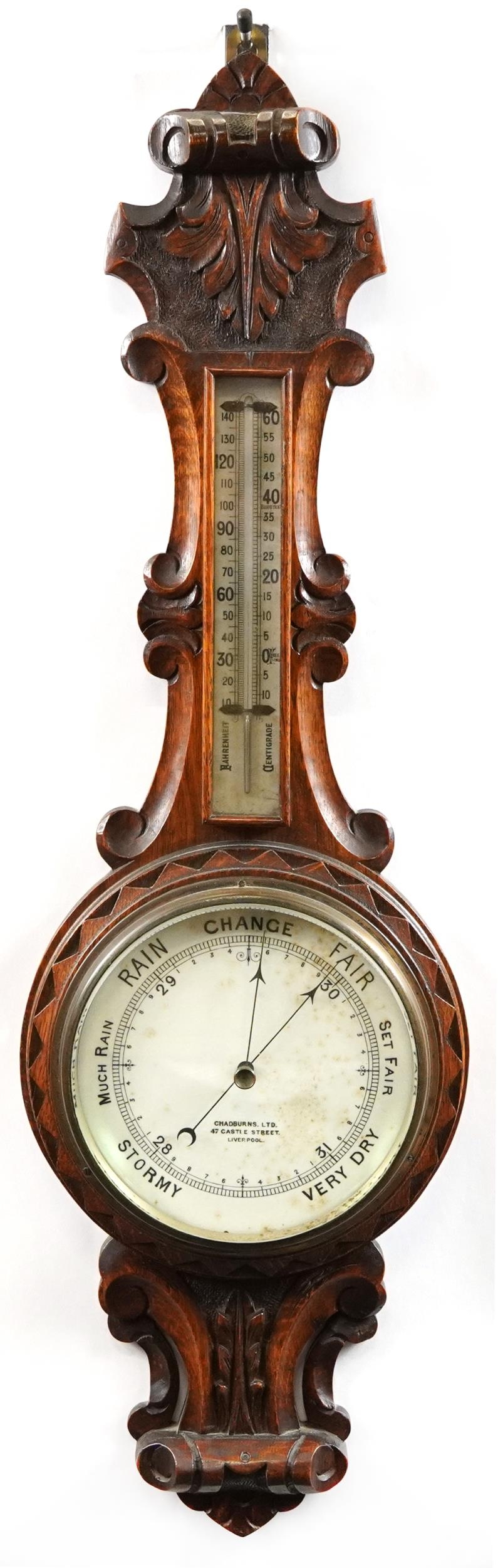 Carved oak barometer, the dial inscribed Chadburns Ltd, 47 Castle Street Liverpool, 85cm high