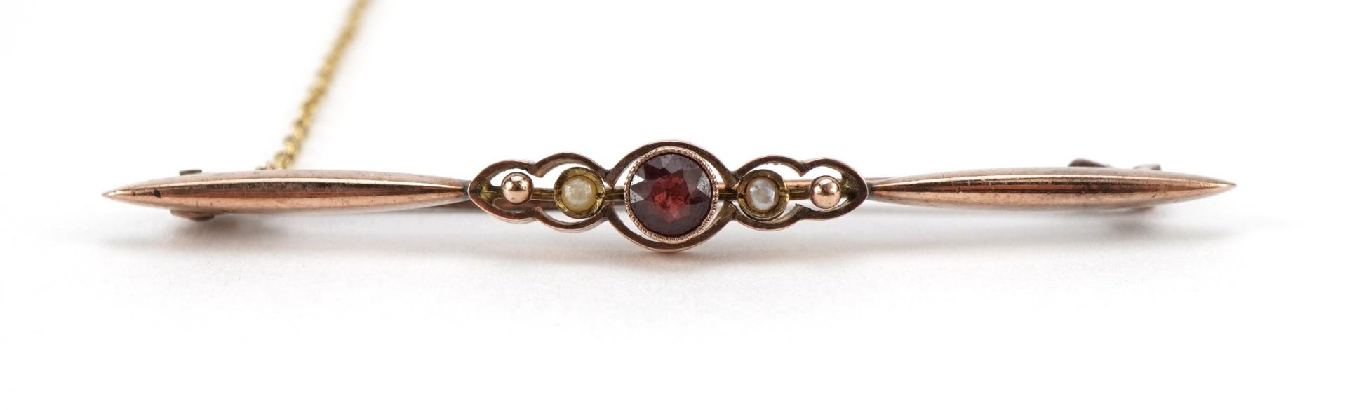 Antique 9ct gold garnet and seed pearl bar brooch with safety chain, 5.5cm wide, 2.9g