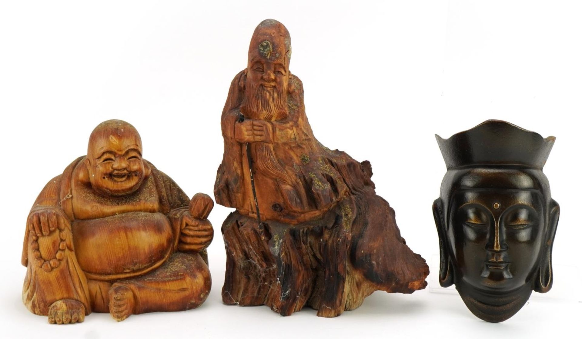 Chino Tibetan patinated cast metal wall plaque in the form of Guanyin and two rootwood carvings, the