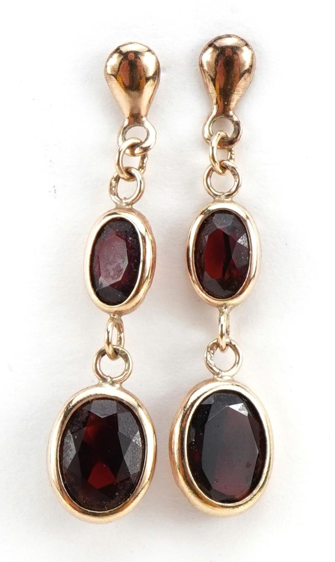 Pair of unmarked gold garnet drop earrings, 3.1cm high, 1.4g