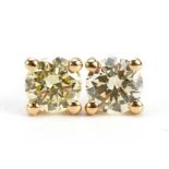 Pair of 18ct gold diamond solitaire stud earrings, total diamond weight approximately 0.61 carat,