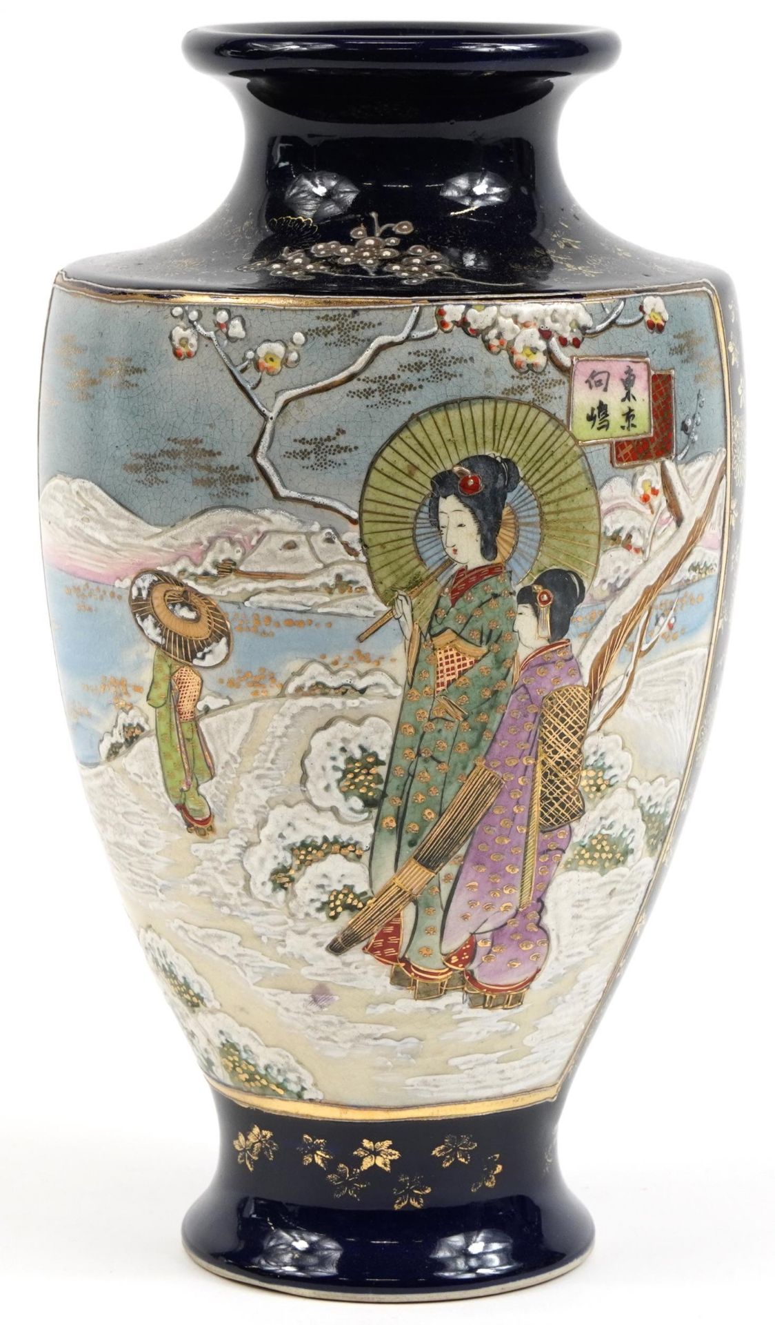 Japanese Satsuma pottery vase hand painted with figures in a snowy landscape, 32cm high